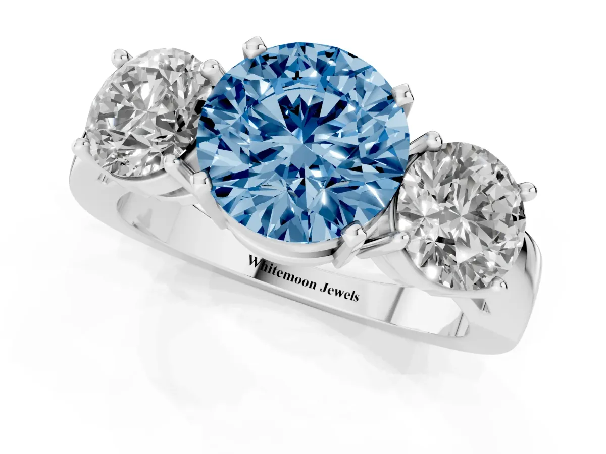 Fancy Blue Three-Stone Round Cut Diamond Ring with Round Side Stones, Classic Band, and Four-Prong Setting White gold