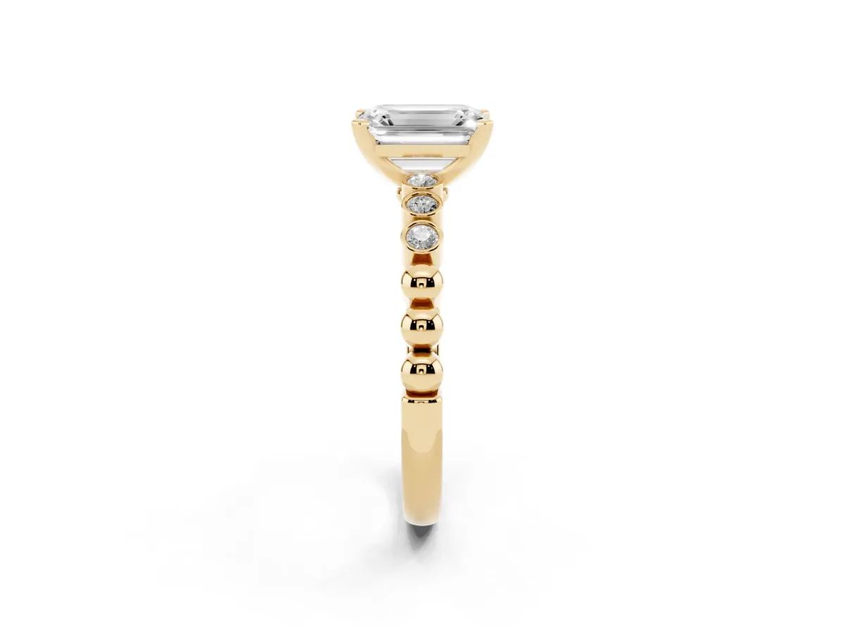 Emerald Cut Solitaire Bezel Accent Diamond Engagement Ring with Beaded Band and Four-Prong Setting Yellow gold