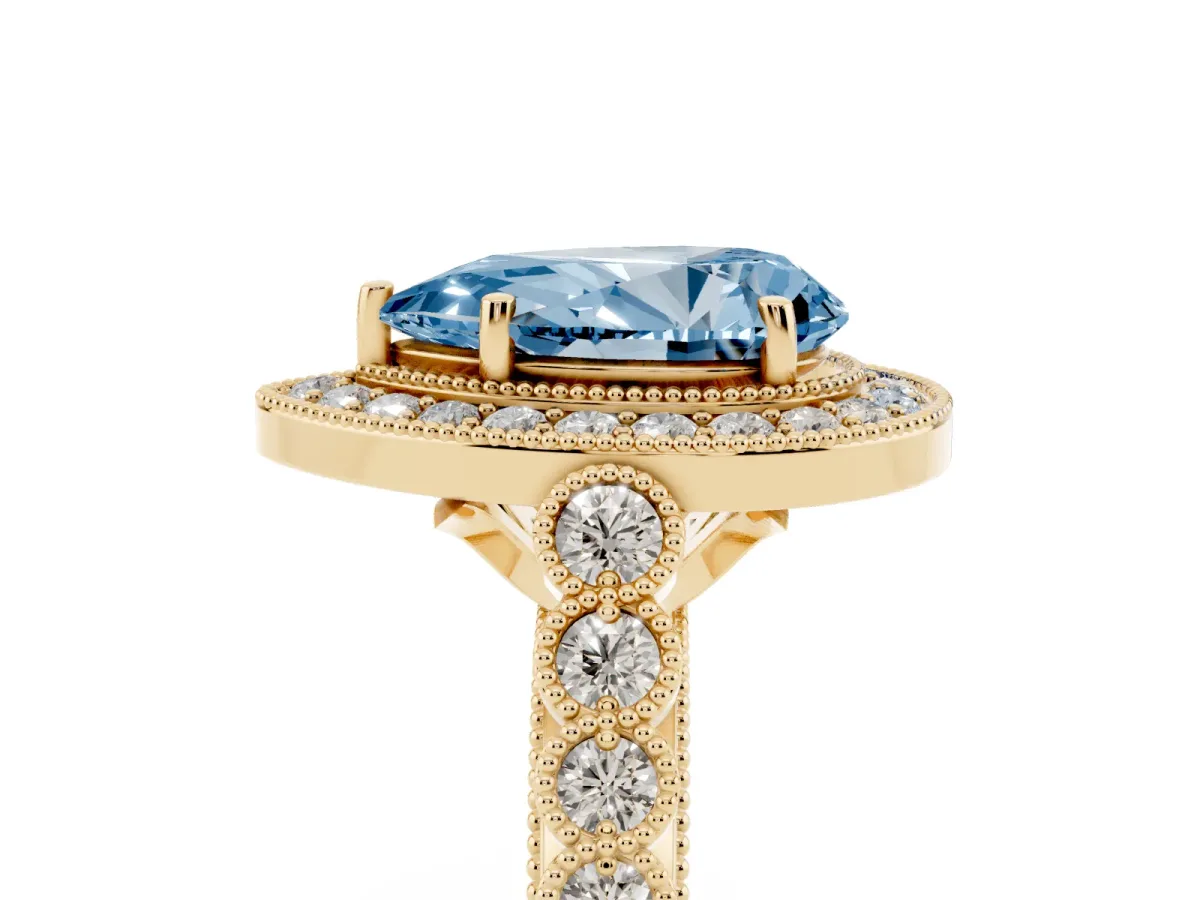 Fancy Blue Pear Cut Halo Milgrain Solitaire with Bezel Set Side Stones and Pave Band Yellow gold