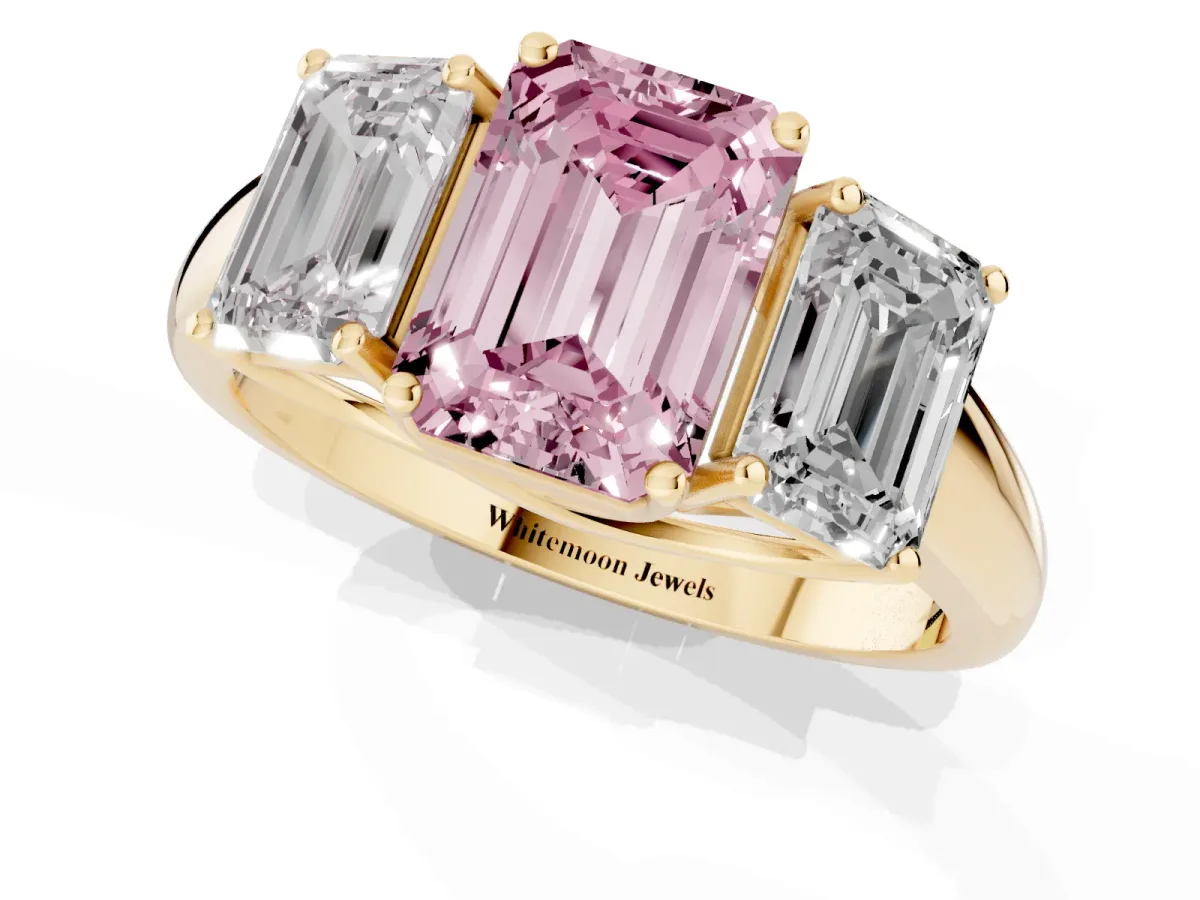 Fancy Pink Three-Stone Emerald Cut Diamond Engagement Ring with Prong Setting Yellow gold