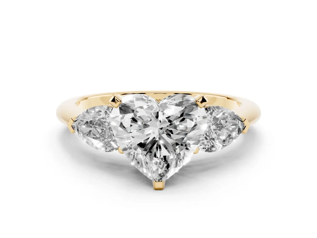 Three-Stone Heart Cut Diamond Ring with Pear Side Stones and Four-Prong Setting Yellow gold