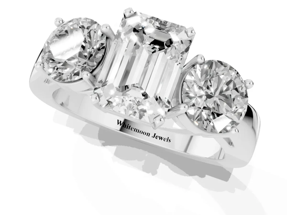 Three-Stone Emerald Cut Diamond Ring with Round Side Stones, Classic Band, and Four-Prong Setting Silver