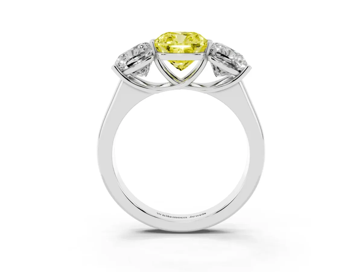 Fancy Yellow Cushion Cut Three-Stone Diamond Ring with Prong Setting on a Classic Band Platinum