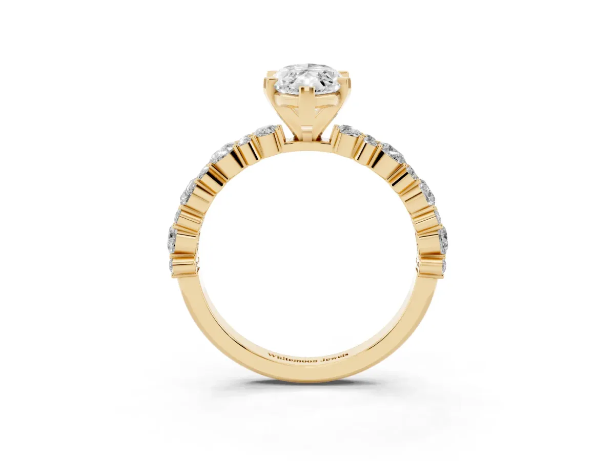 Marquise Cut Diamond Side Stone Solitaire Ring with Round and Four-Prong Setting Yellow gold