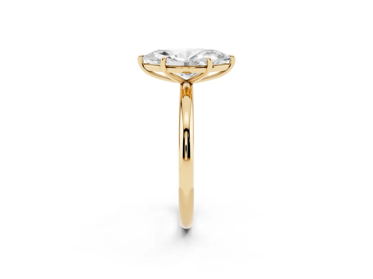 Marquise Cut Solitaire Diamond Ring with Four-Prong Setting on a Plain Band Yellow gold