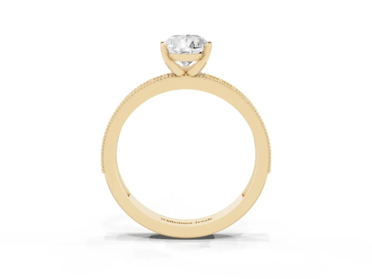 Pear Cut Diamond Milgrain Pavé Engagement Ring with Four-Prong Setting Yellow gold