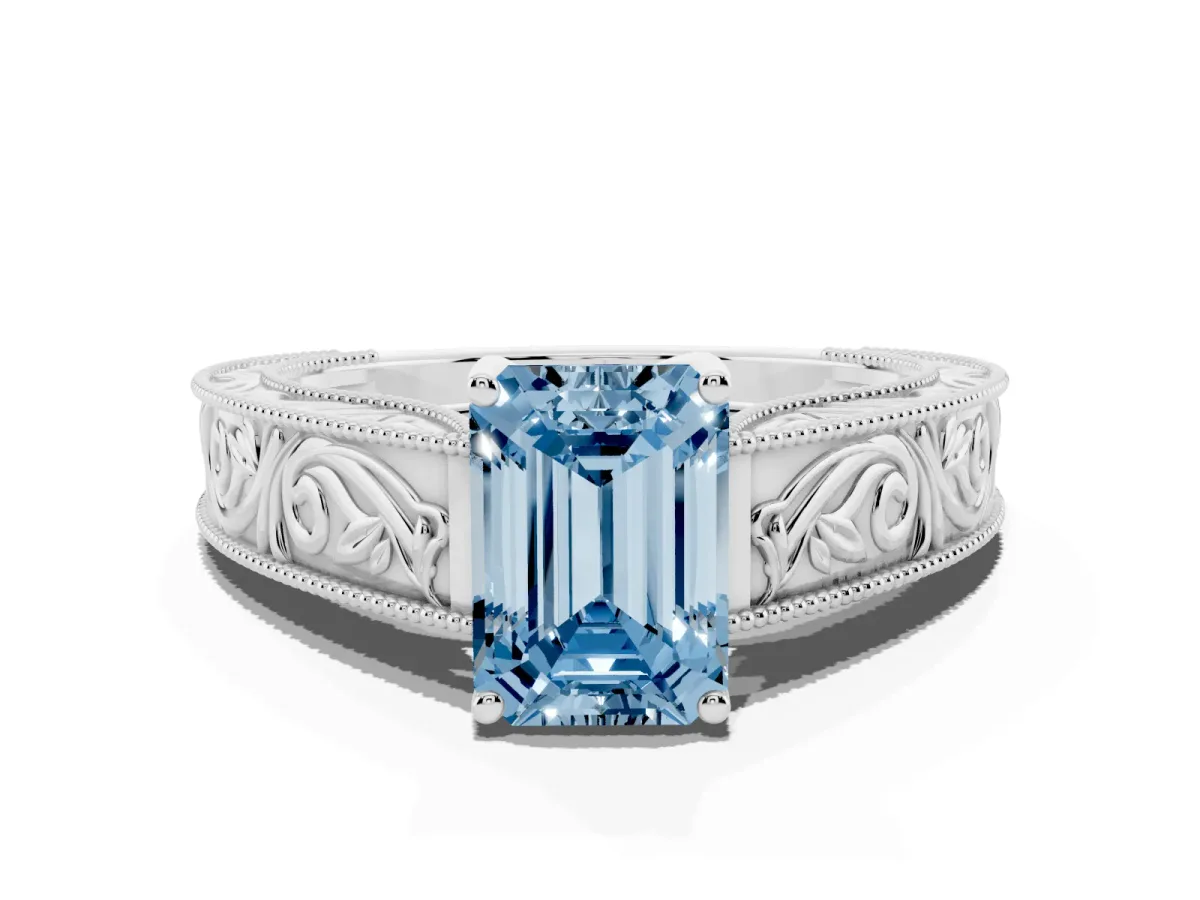 Fancy Blue Emerald Cut Diamond Solitaire Ring with Engraved Band and Four-Prong Setting Platinum