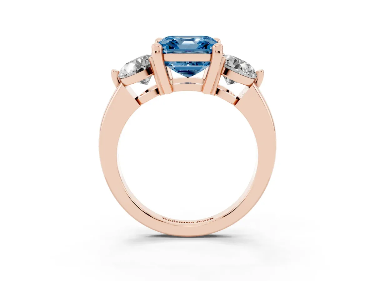Fancy Blue Three-Stone Asscher Cut Brilliant Cut Solitaire Ring with Prong Setting on a Classic Band Rose gold