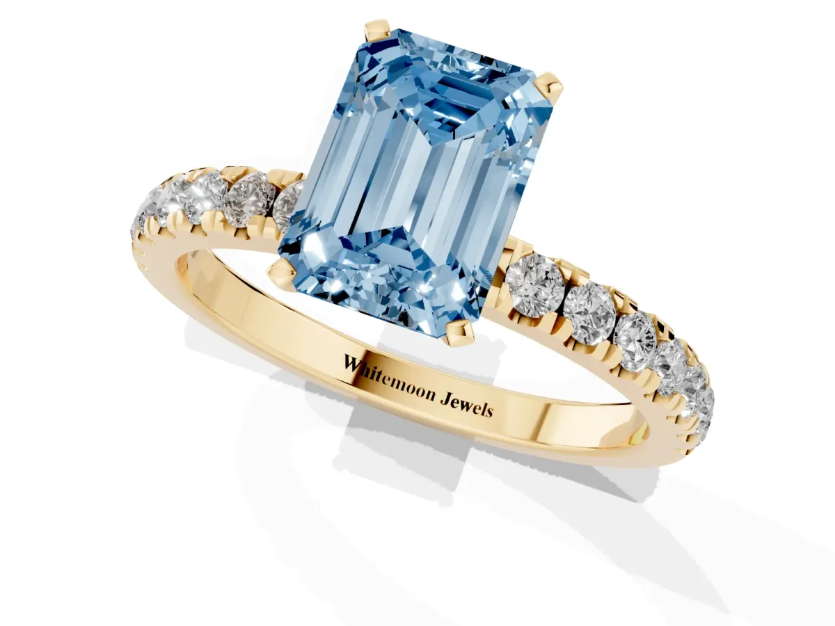 Fancy Blue Emerald Cut Diamond Solitaire Ring with Pavé Accents and Four-Prong Setting Yellow gold