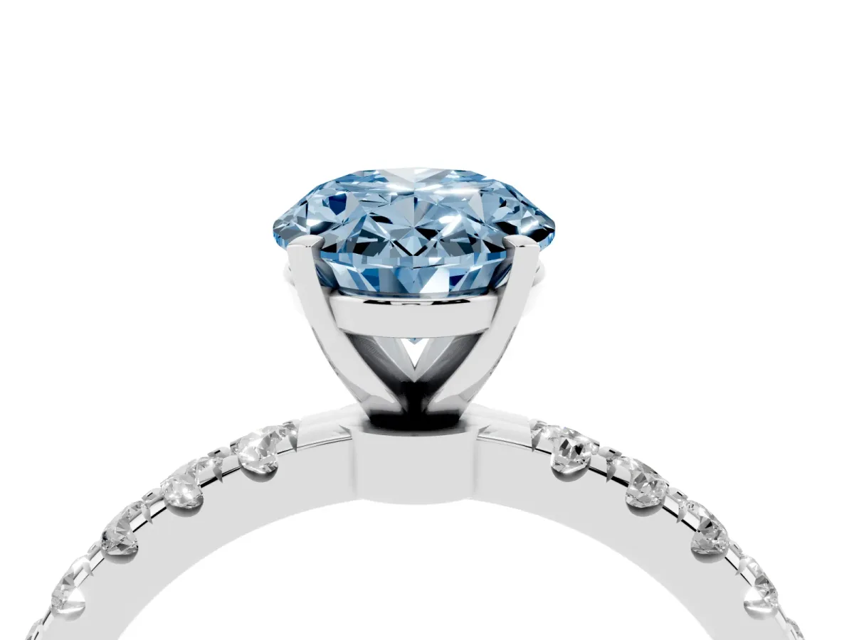 Fancy Blue Oval Cut Diamond Solitaire Ring with Pavé Accents and Four-Prong Setting Silver