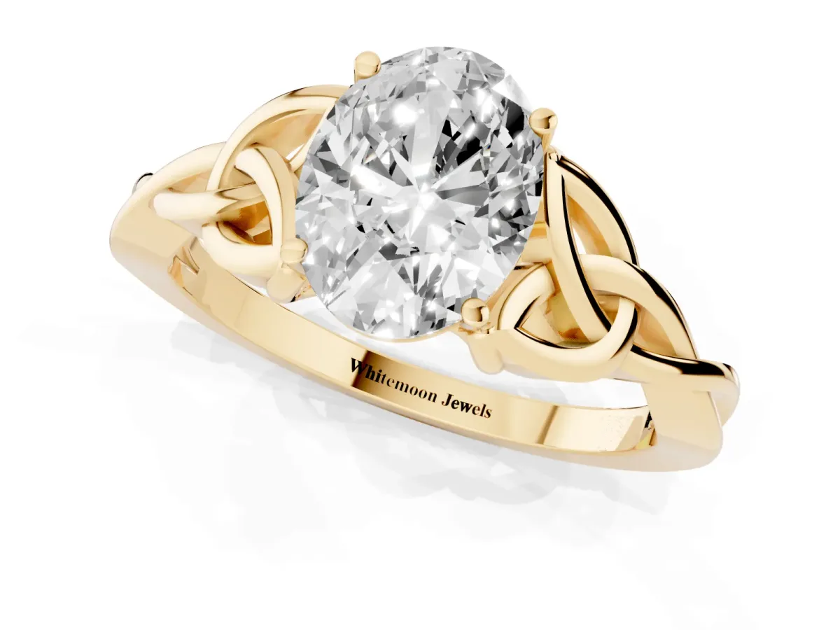 Oval Cut Diamond Solitaire Engagement Ring with Celtic Knot Band and Four-Prong Setting Yellow gold
