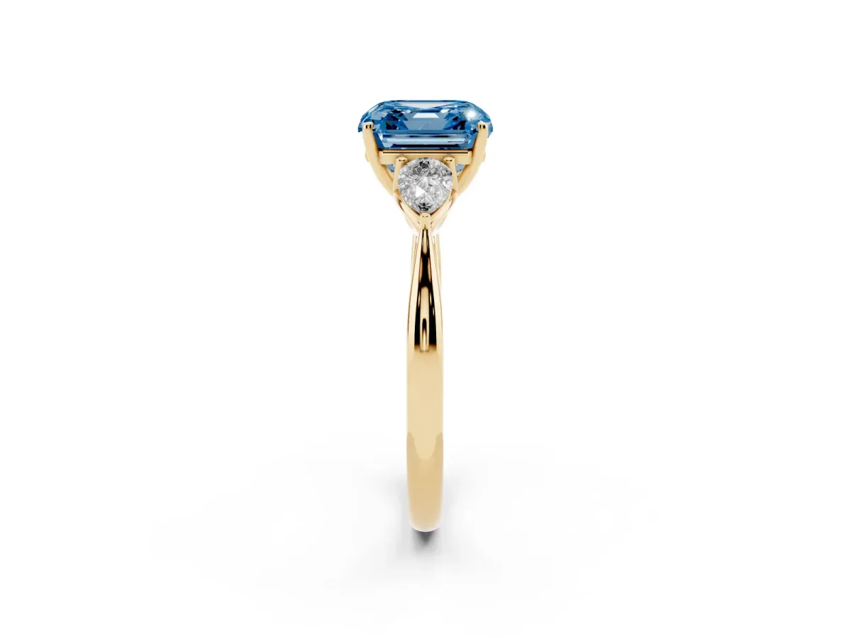 Fancy Blue Asscher Cut Diamond Three-Stone Ring with Pear Side Stones and Prong Setting Yellow gold