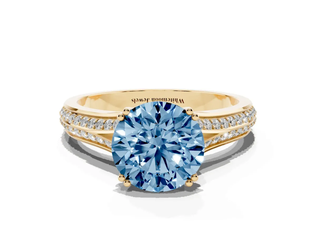 Fancy Blue Round Cut Diamond Split Shank Engagement Ring with Pavé Band Yellow gold