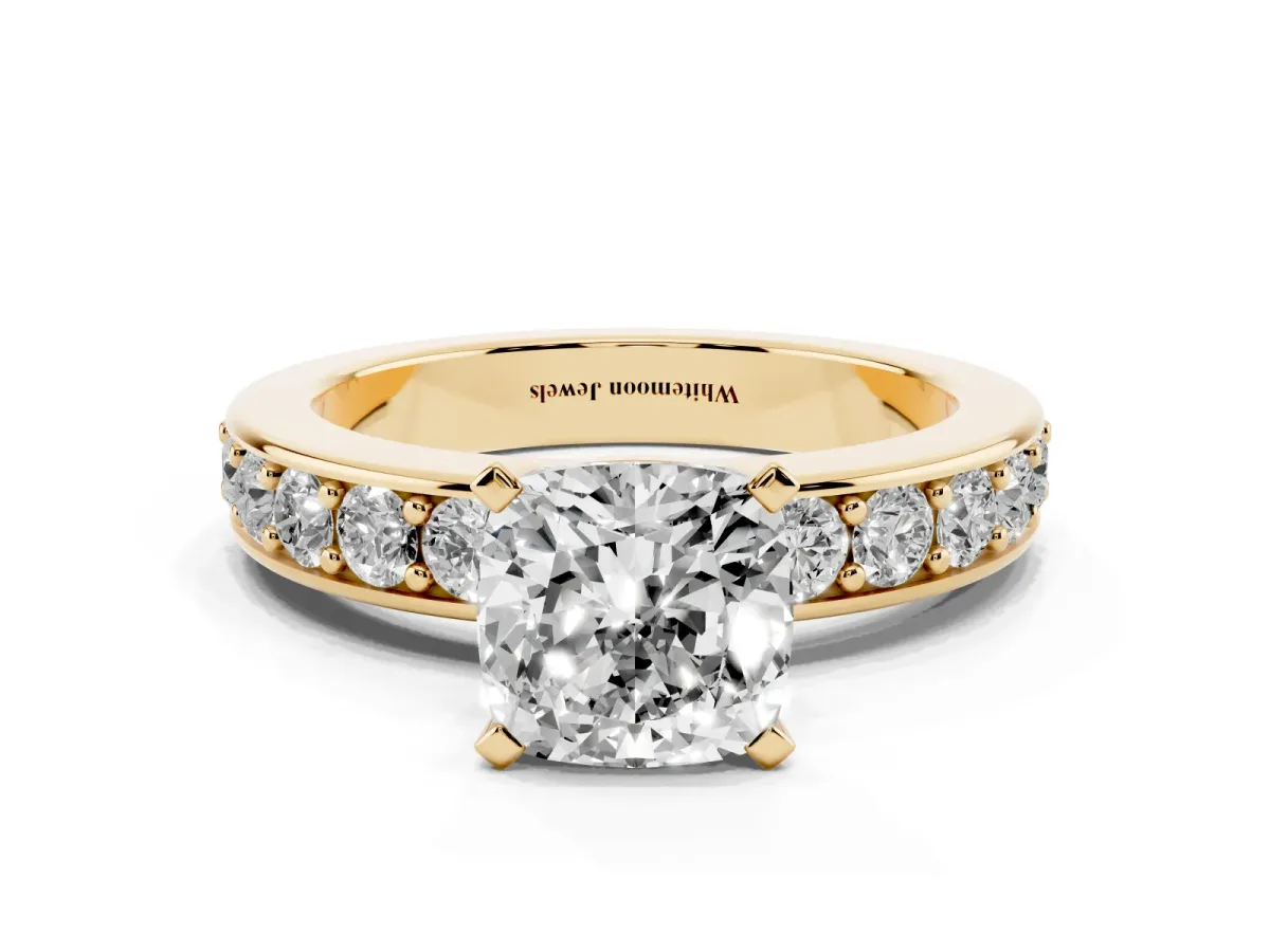 Cushion Cut Diamond Engagement Ring with Channel Set Round Band and Prong Setting Yellow gold