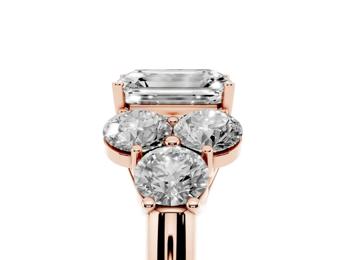 Emerald Cut Cut Diamond Cluster Ring with Round Accent Stones and Prong Setting on a Classic Band Rose gold