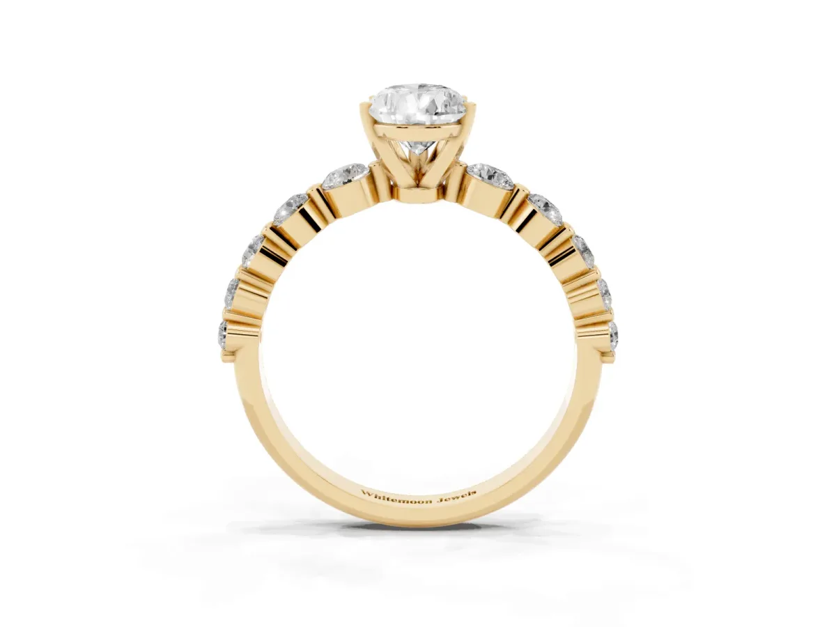 Pear Cut Solitaire Diamond Ring with Pave Band and Four-Prong Setting Yellow gold