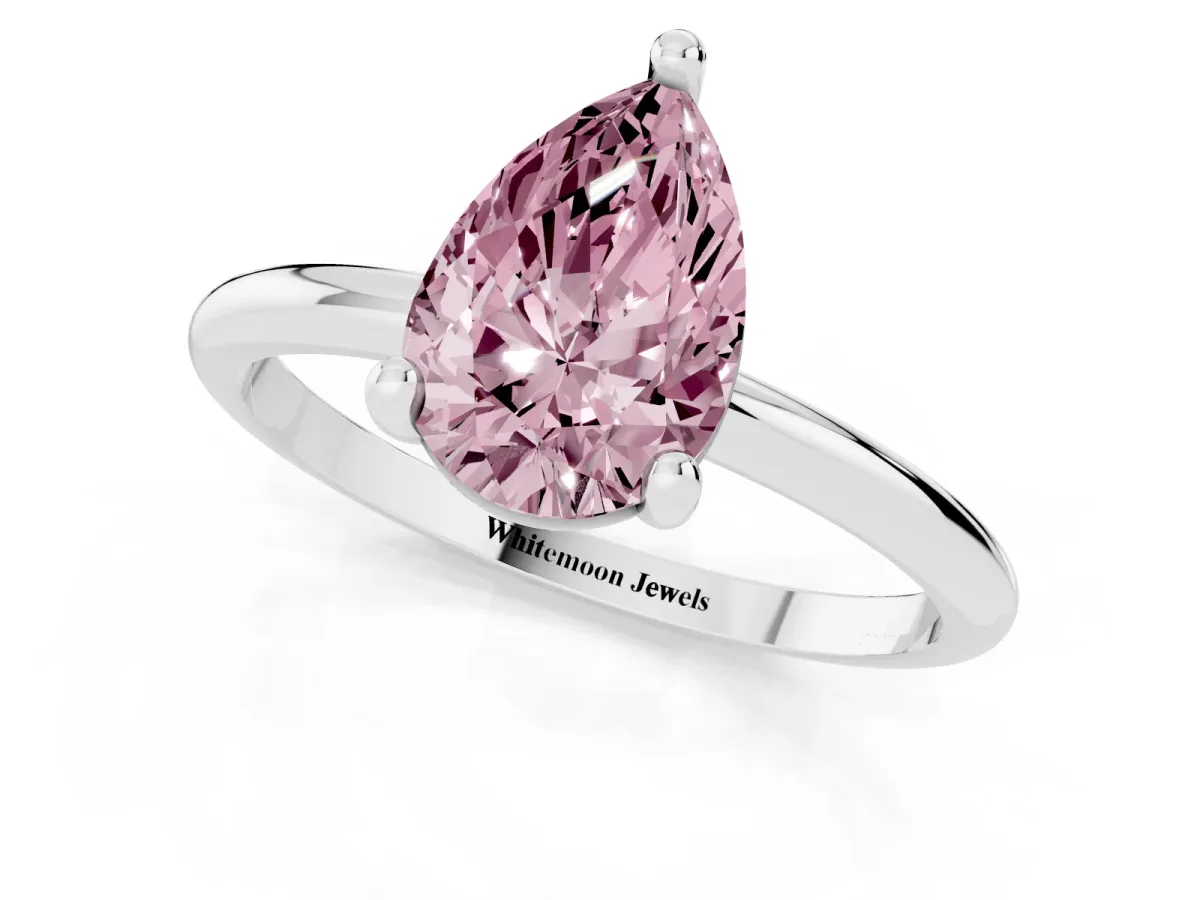 Fancy Pink Pear Cut Solitaire Diamond Ring with 4-Prong Setting on a Classic Band Silver