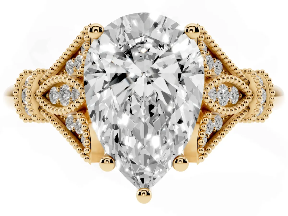 Pear Cut Diamond Solitaire Ring with Floral Filigree and Pave Accents Yellow gold