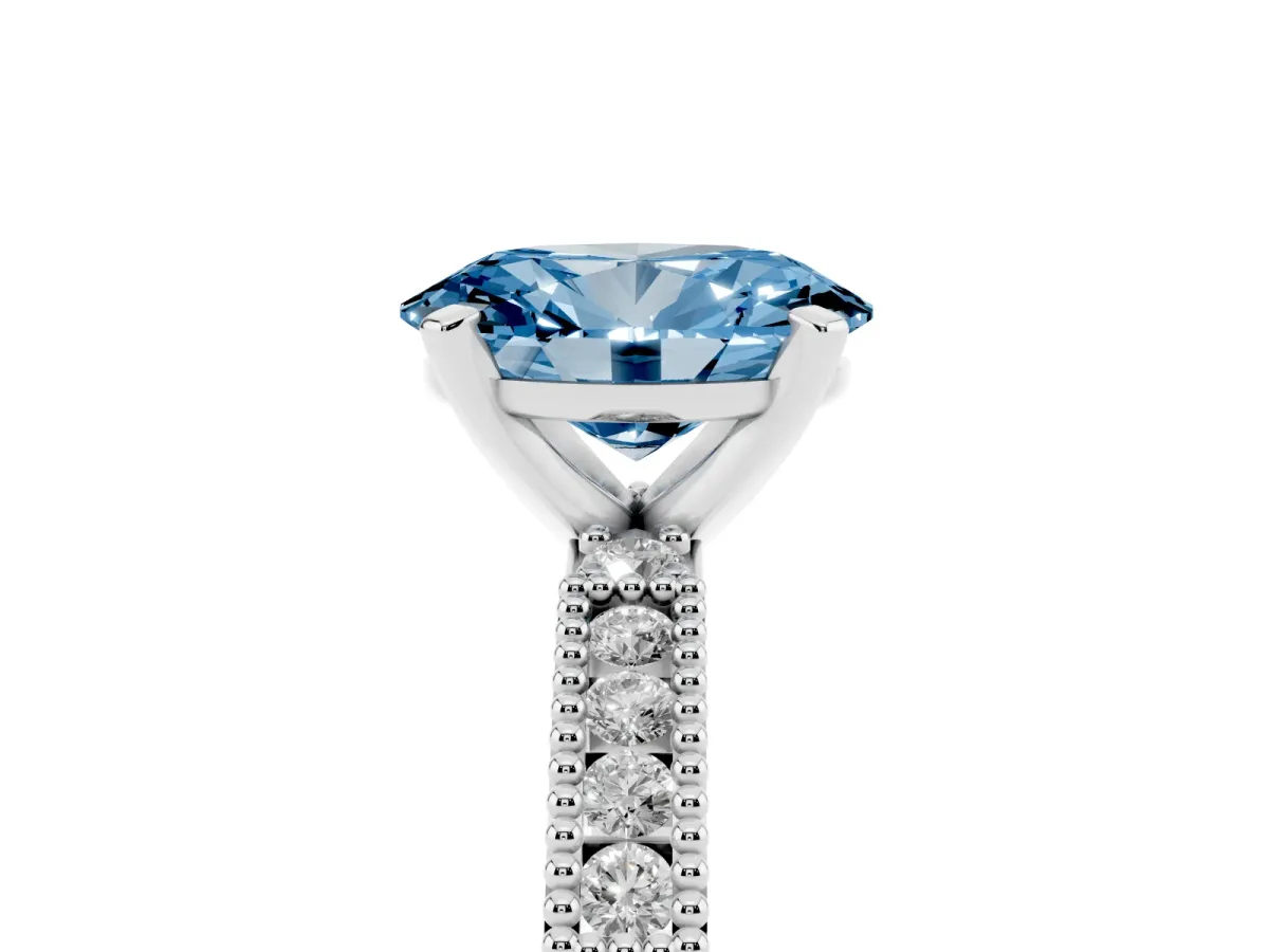 Fancy Blue Oval Cut Solitaire with Pavé Band and Four-Prong Setting Silver