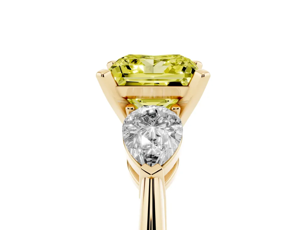 Fancy Yellow Three-Stone Princess Cut Diamond Ring with Pear Side Stones and Four-Prong Setting Yellow gold