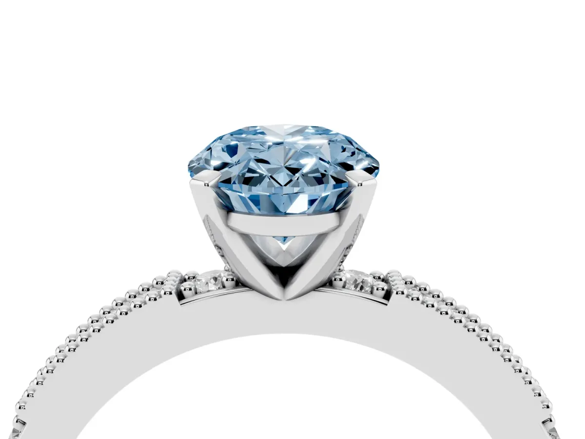 Fancy Blue Oval Cut Solitaire with Pavé Band and Four-Prong Setting Silver