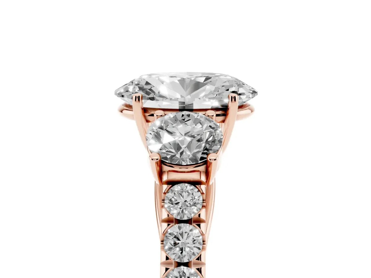 Oval Cut Cut Diamond Three-Stone Ring with Round Side Stones and Pavé Band Rose gold