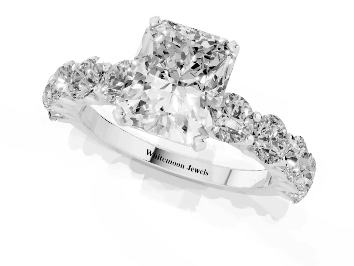 Radiant Cut Diamond Prong Setting with Side Stones on a Pave Band Silver