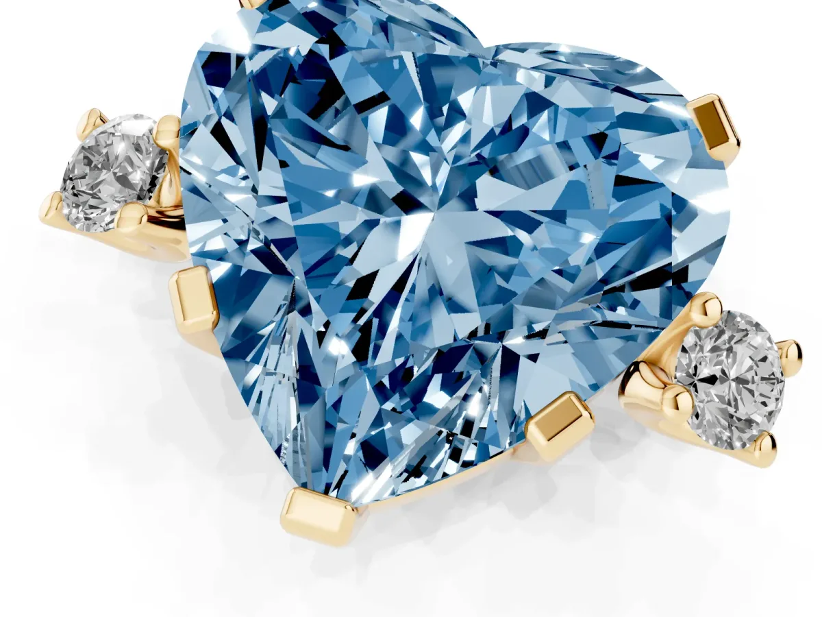 Fancy Blue Heart Cut Cut Three-Stone Solitaire Ring with Round Accent Diamonds and Four-Prong Setting Yellow gold