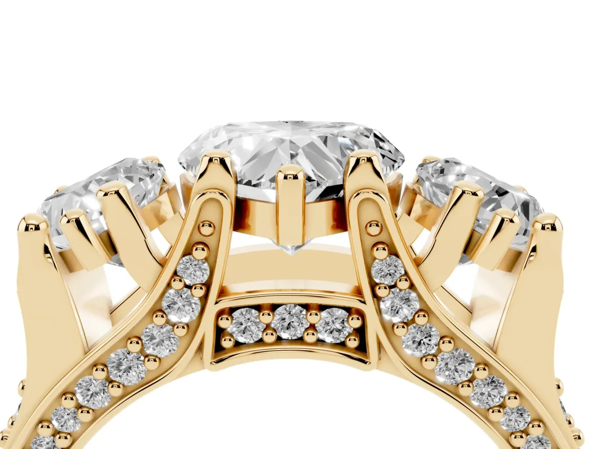 Heart Cut Diamond Three-Stone Ring with Channel Set Band and Four-Prong Setting Yellow gold