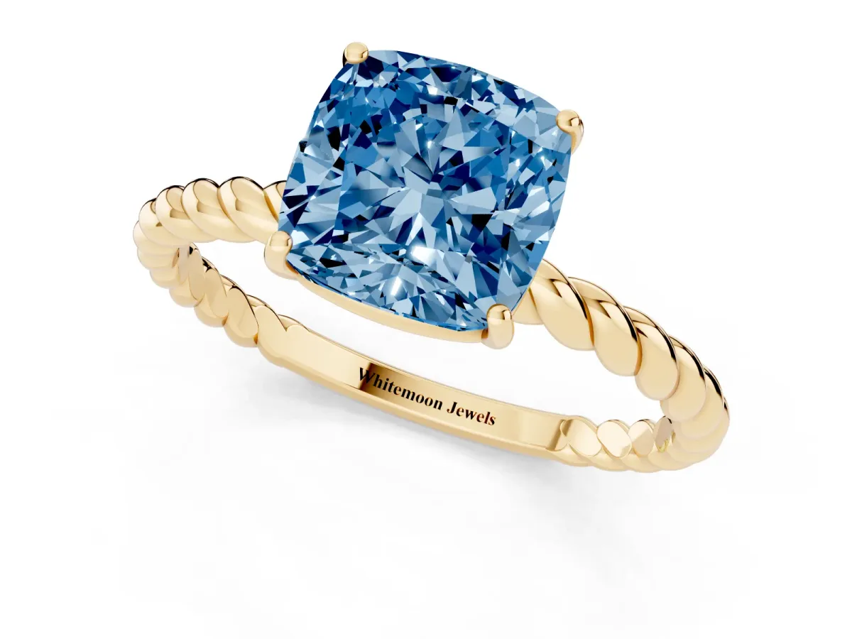 Fancy Blue Cushion Cut Solitaire Twist Band Ring with Four-Prong Setting Yellow gold