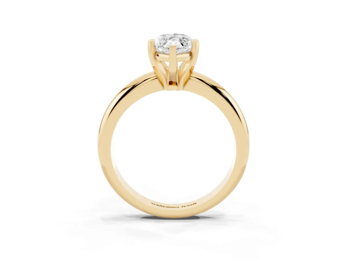 Marquise Cut Diamond Solitaire Engagement Ring with Round Band and Four-Prong Setting Yellow gold