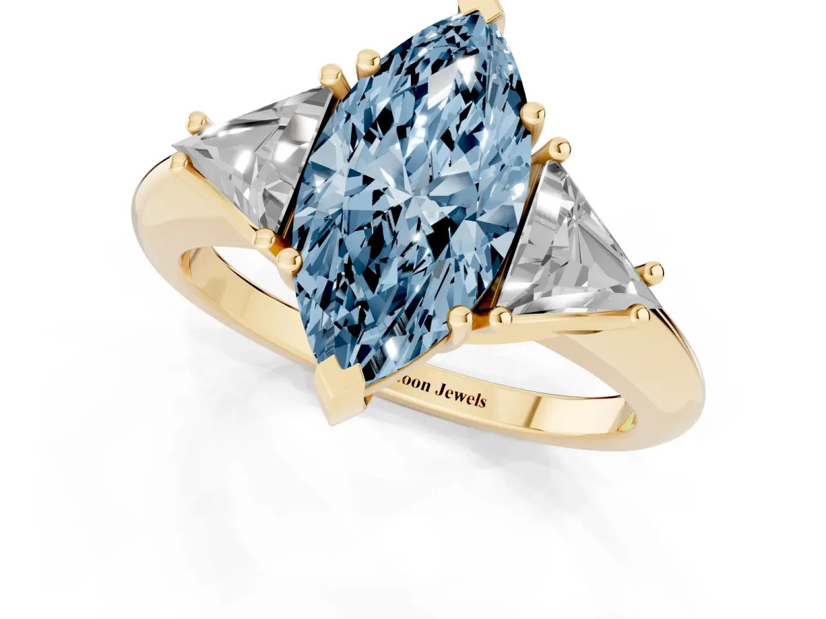Fancy Blue Three-Stone Marquise Cut Diamond Engagement Ring with Trillion Side Stones and Prong Setting Yellow gold