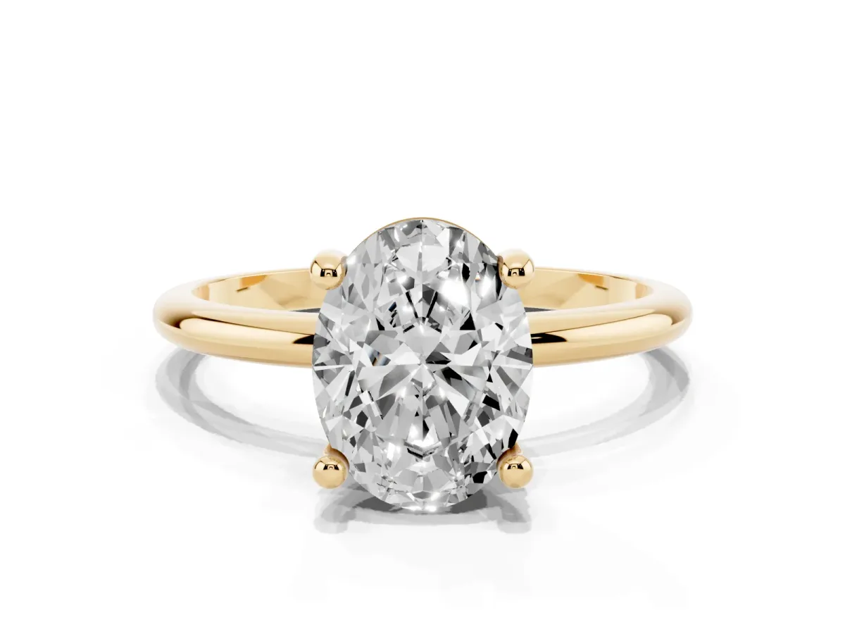 Oval Cut Solitaire Diamond Ring with 4-Prong Setting on a Classic Band Yellow gold