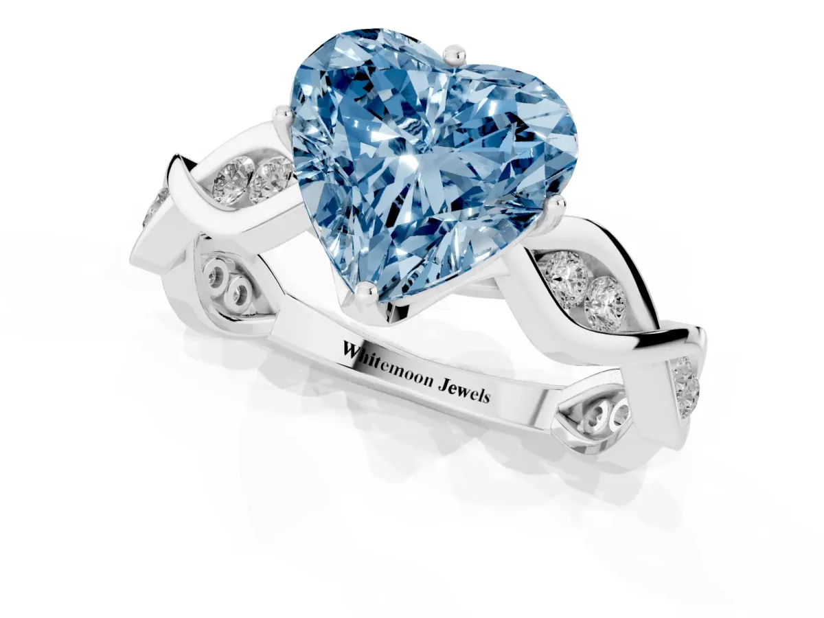 Fancy Blue Heart Cut Solitaire Twist Band with Leaf Prong Setting Platinum