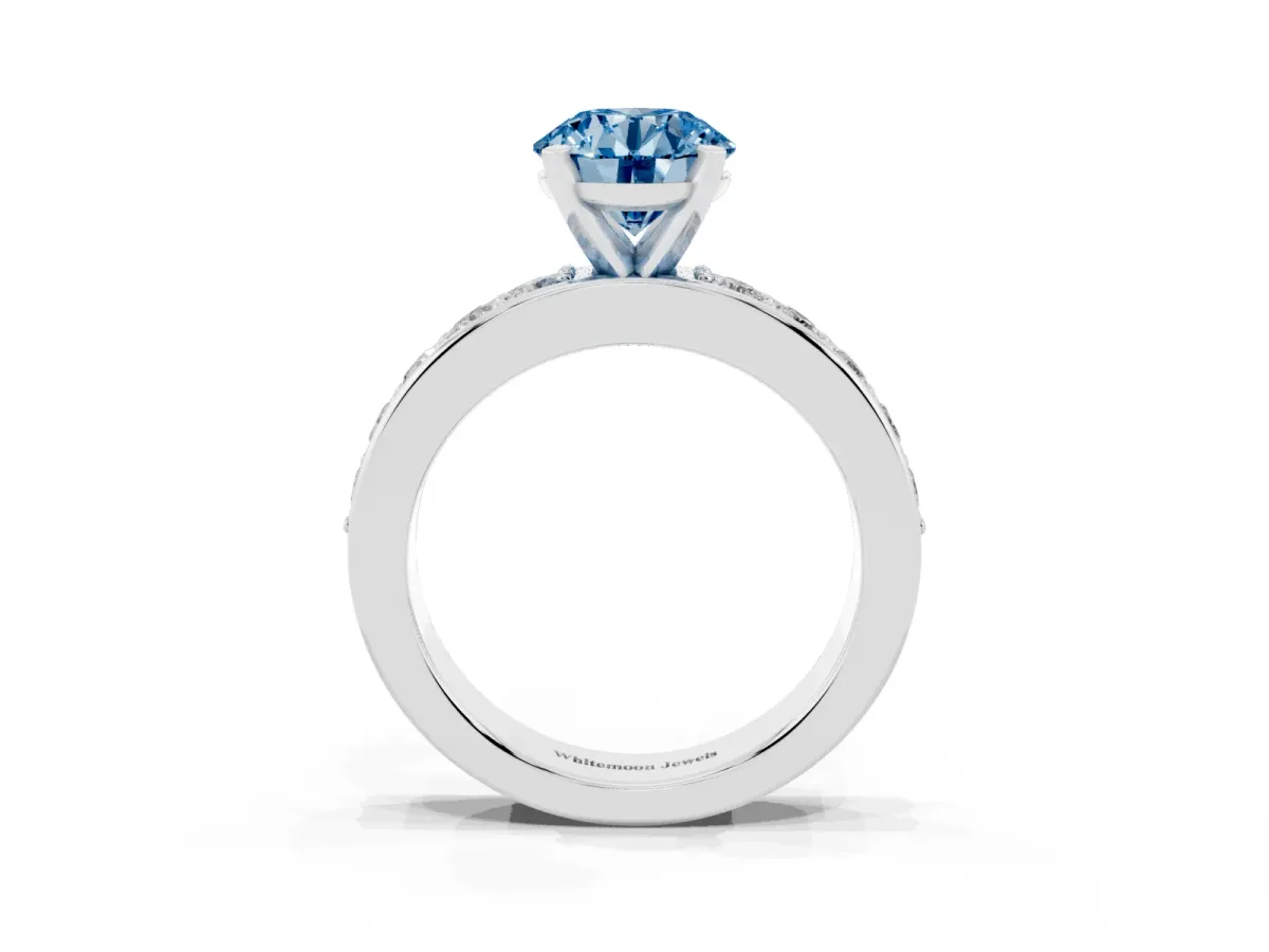Fancy Blue Round Cut Diamond Engagement Ring with Channel Set Round Band and Prong Setting White gold