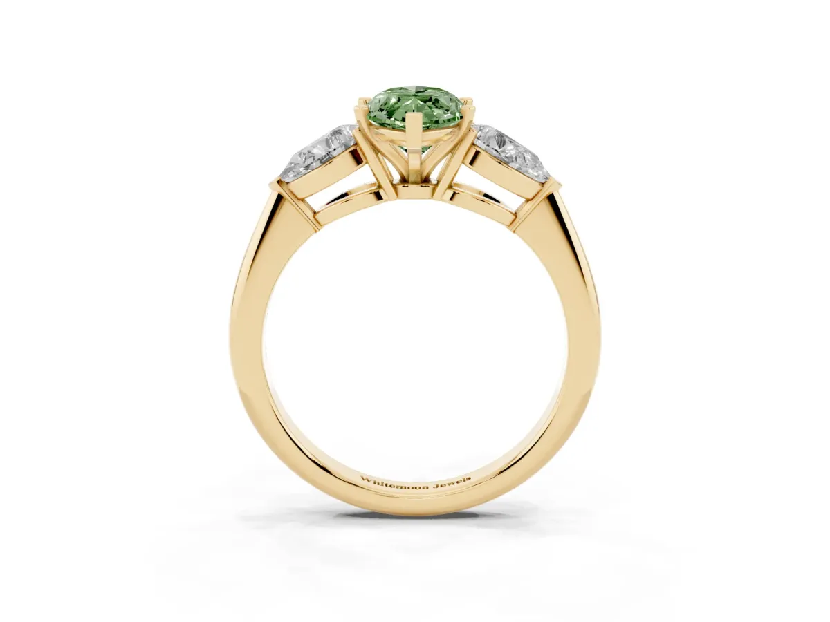 Fancy Green Three-Stone Marquise Cut Diamond Ring with Pear Side Stones and Four-Prong Setting Yellow gold