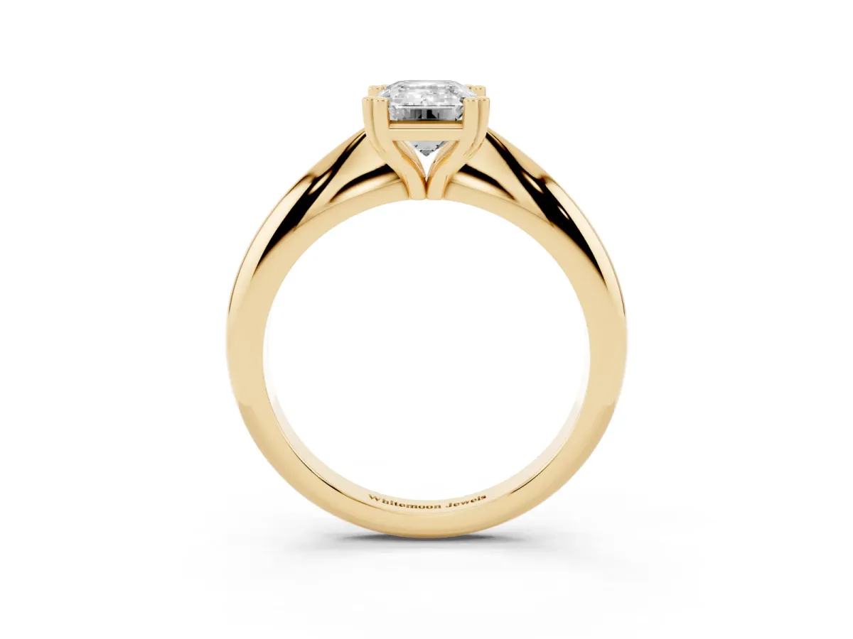 Emerald Cut Cut Solitaire Engagement Ring with Tapered Band and Four-Prong Setting Yellow gold