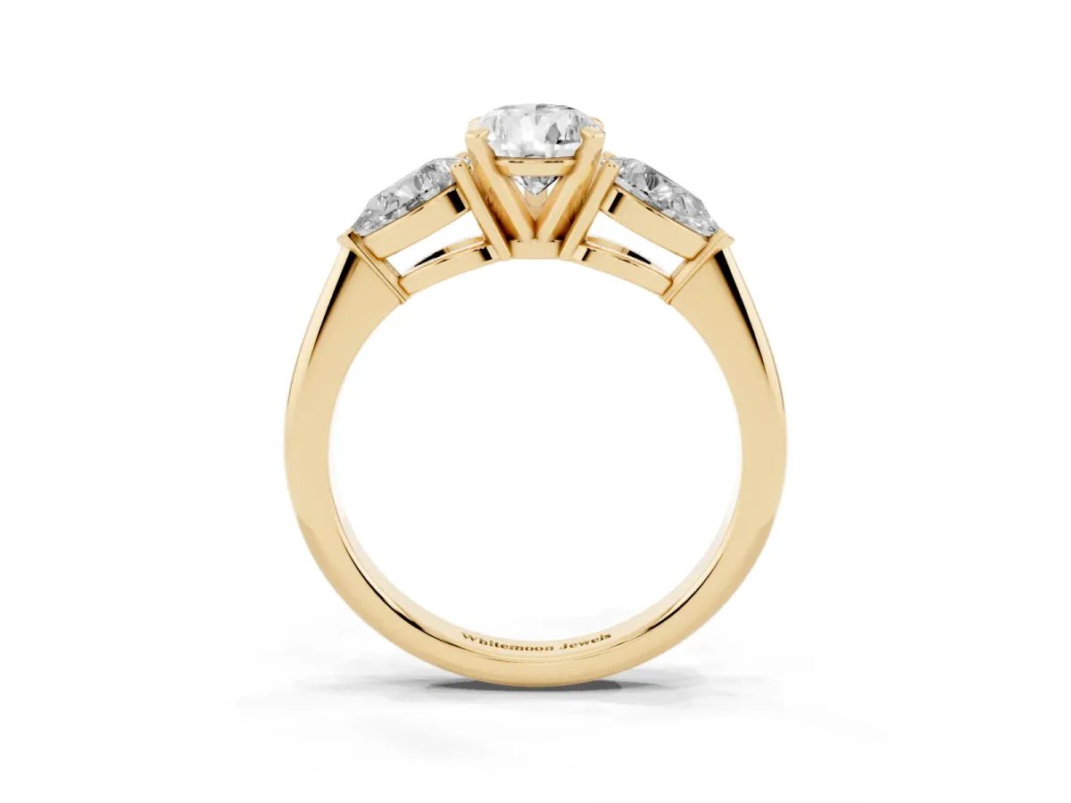 Three-Stone Pear Cut Diamond Ring with Pear Side Stones and Four-Prong Setting Yellow gold