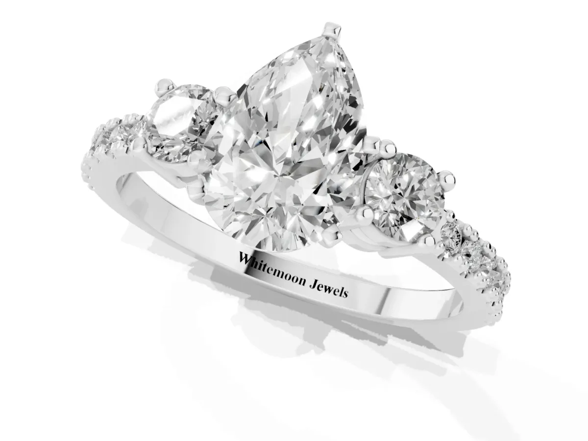 Pear Cut Three-Stone Diamond Pavé Band with Prong Setting Platinum