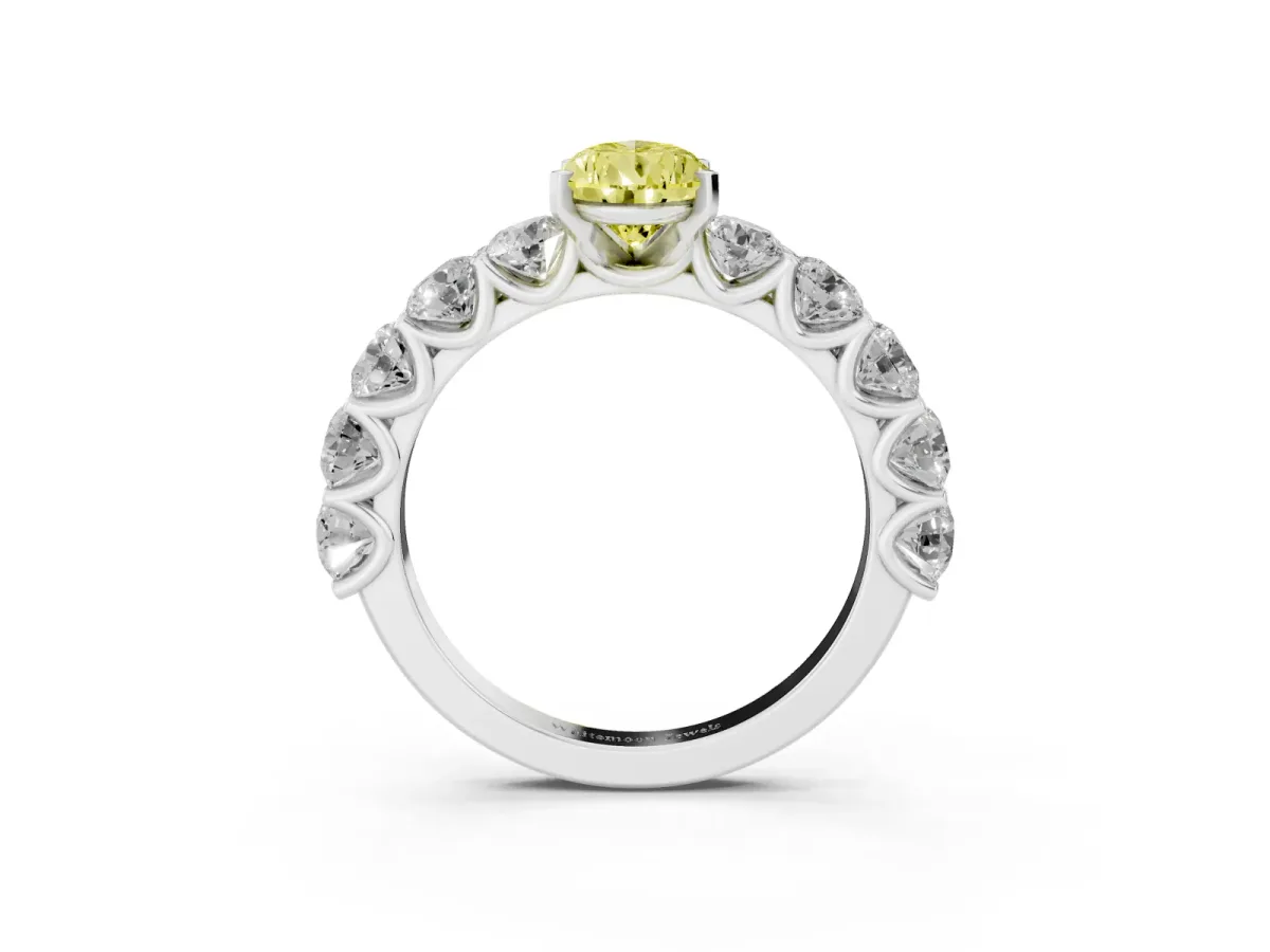 Fancy Yellow Pear Cut Diamond Prong Setting with Side Stones on a Pave Band Silver