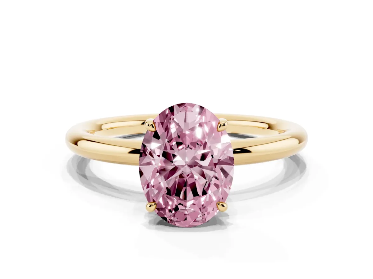 Fancy Pink Oval Cut Diamond Solitaire Ring with Thin Band and Four-Prong Setting Yellow gold