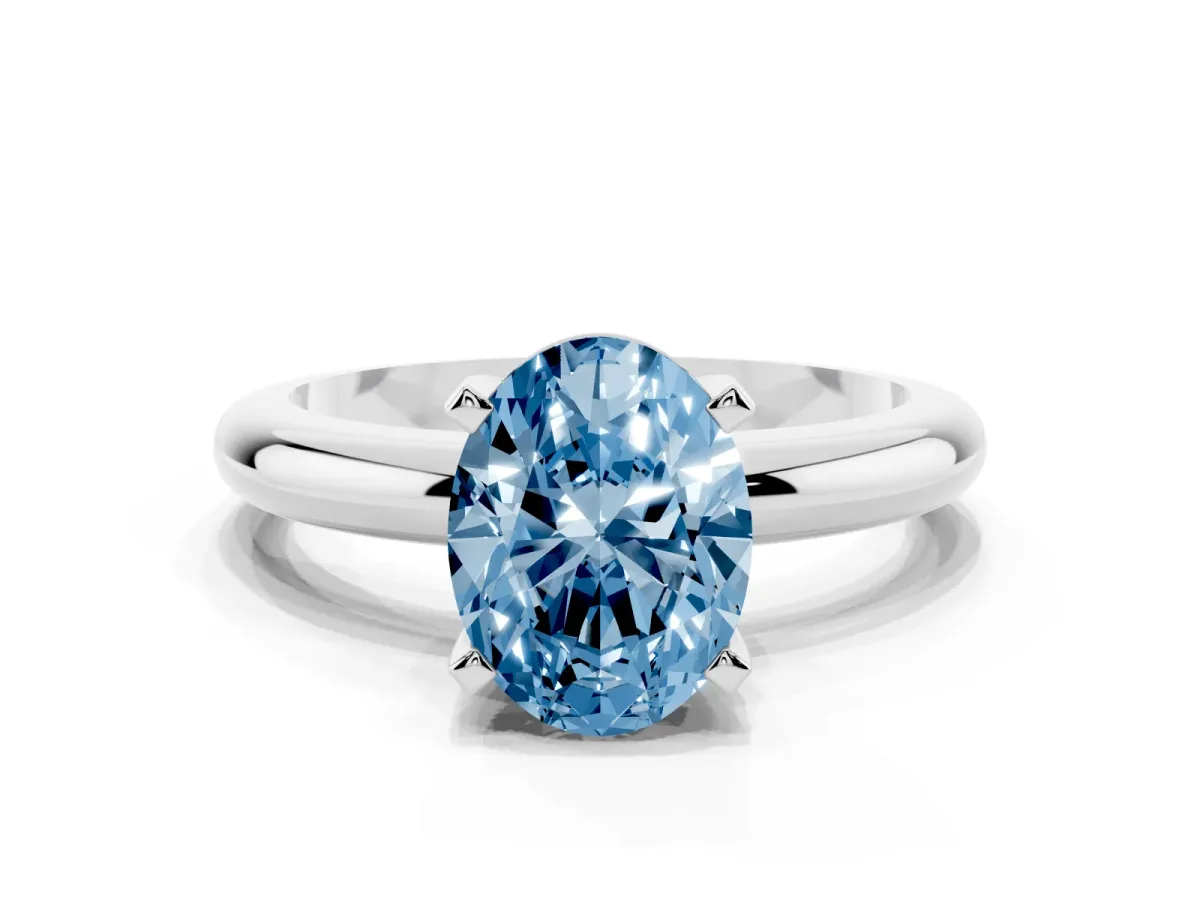 Fancy Blue Oval Cut Diamond Solitaire Engagement Ring with Round Band and Four-Prong Setting Platinum