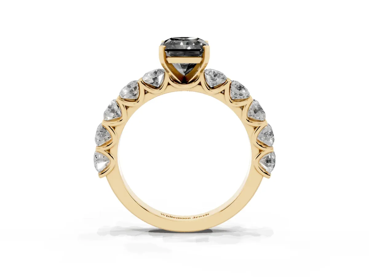Fancy Black Radiant Cut Diamond Prong Setting with Side Stones on a Pave Band Yellow gold