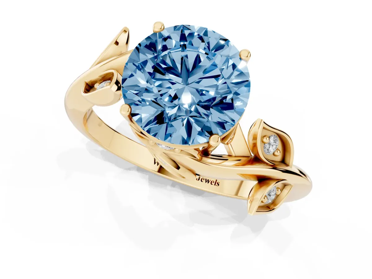 Fancy Blue Round Cut Solitaire Twist Engagement Ring with Leaf Accents and Prong Setting Yellow gold