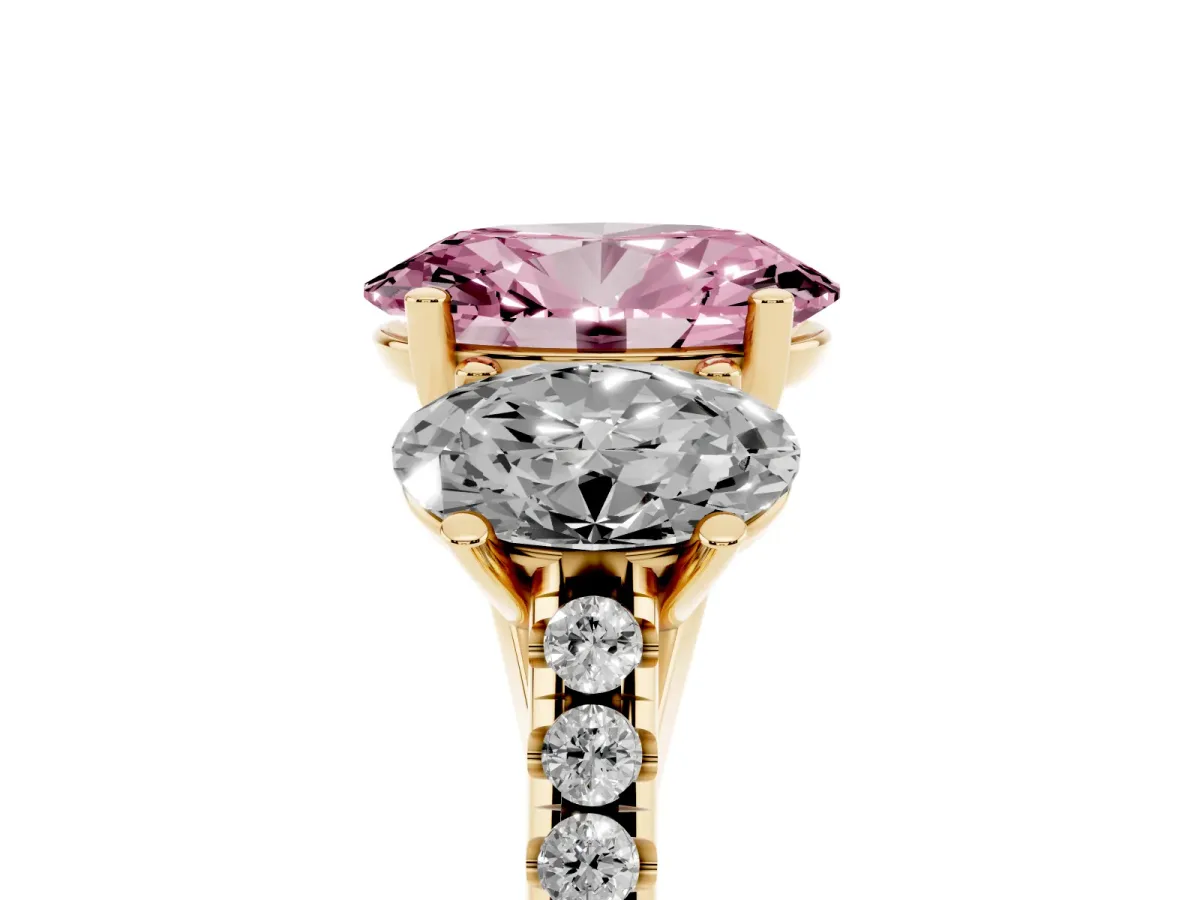 Fancy Pink Three-Stone Oval Cut Diamond Ring with Round Pavé Band and Prong Setting Yellow gold