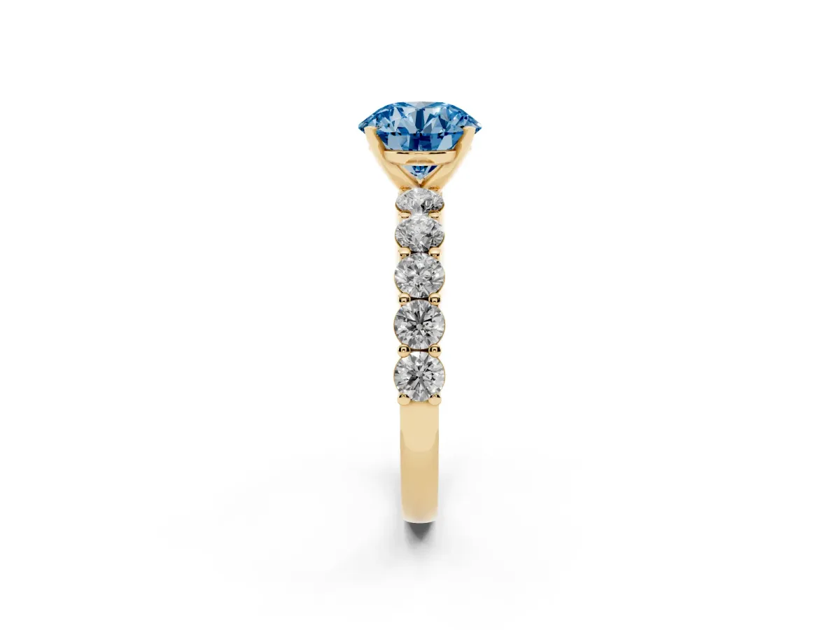 Fancy Blue Round Cut Diamond Solitaire Ring with Shared Prong Round Side Stones Yellow gold