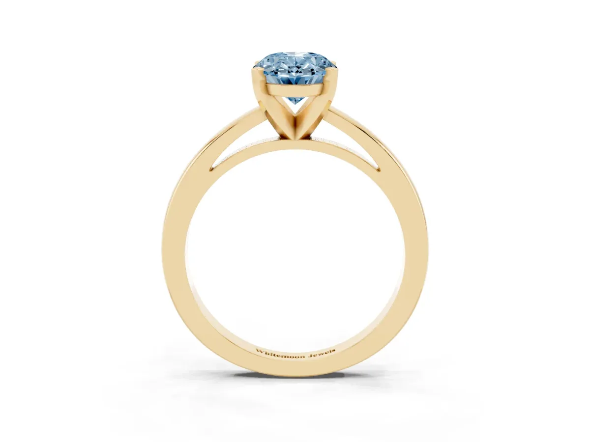 Fancy Blue Oval Cut Solitaire Diamond Engagement Ring with Four-Prong Setting on a Classic Band Yellow gold