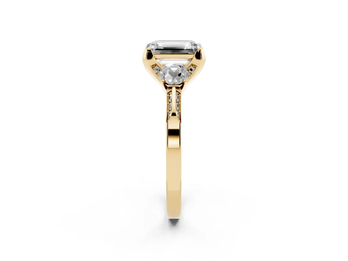 Fancy Blue Emerald Cut Brilliant Three-Stone Diamond Ring with Pavé Band and Four-Prong Setting Yellow gold