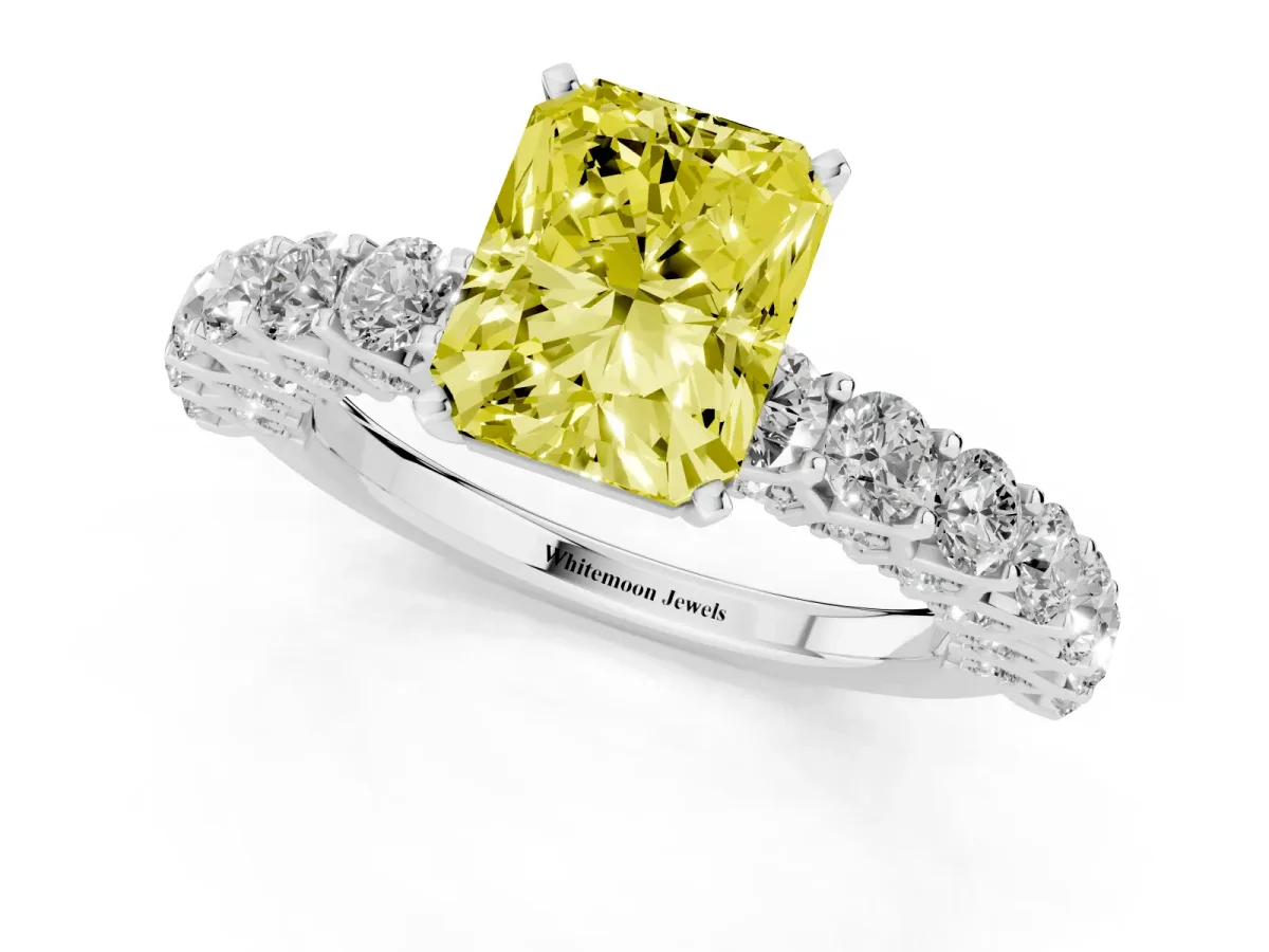 Fancy Yellow Radiant Cut Diamond Solitaire Ring with Shared Prong Pavé Band and Four-Prong Setting Platinum