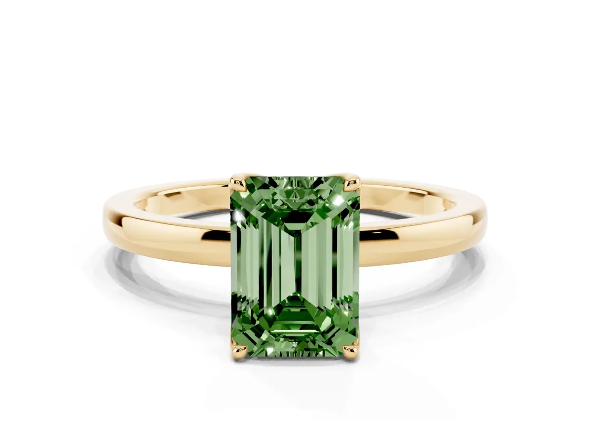 Fancy Green Emerald Cut Diamond Solitaire Ring with Thin Band and Prong Setting Yellow gold